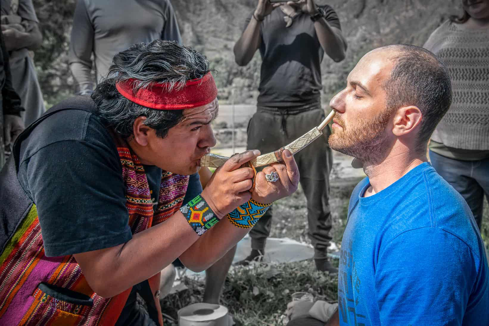 Yoni receiving sacred medicine from a Peruvian shaman, honoring ancestral healing traditions.